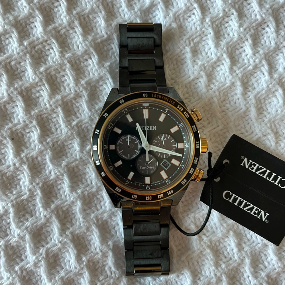 Citizen Men’s Eco Drive WR100 watch in all black/gold.